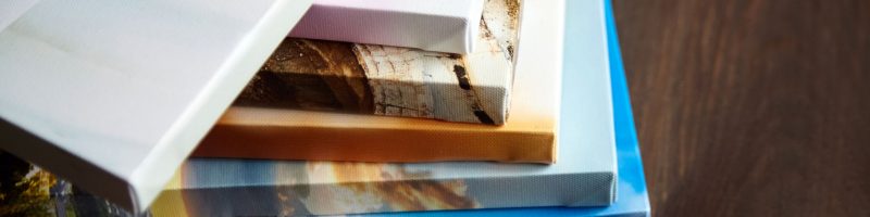Photography canvas prints. Stacked colorful photos with gallery wrapping method of canvas stretching on stretcher bar, lateral side